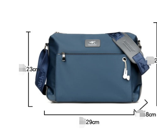 Borsa a tracolla blu da uomo, dimensioni 29x23x8 cm, con tasca frontale con zip e auricolari. Design moderno, ideale per viaggi e uso quotidiano.
