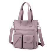 Borsa a tracolla in nylon rosa con tasche multiple, design moderno e funzionale, ideale per donna, perfetta per lavoro e tempo libero.