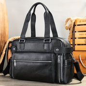 Borsa a tracolla in pelle nera, design elegante con tasche multiple e cerniere, ideale per lavoro e viaggio. Accessorio moda uomo di alta qualità.
