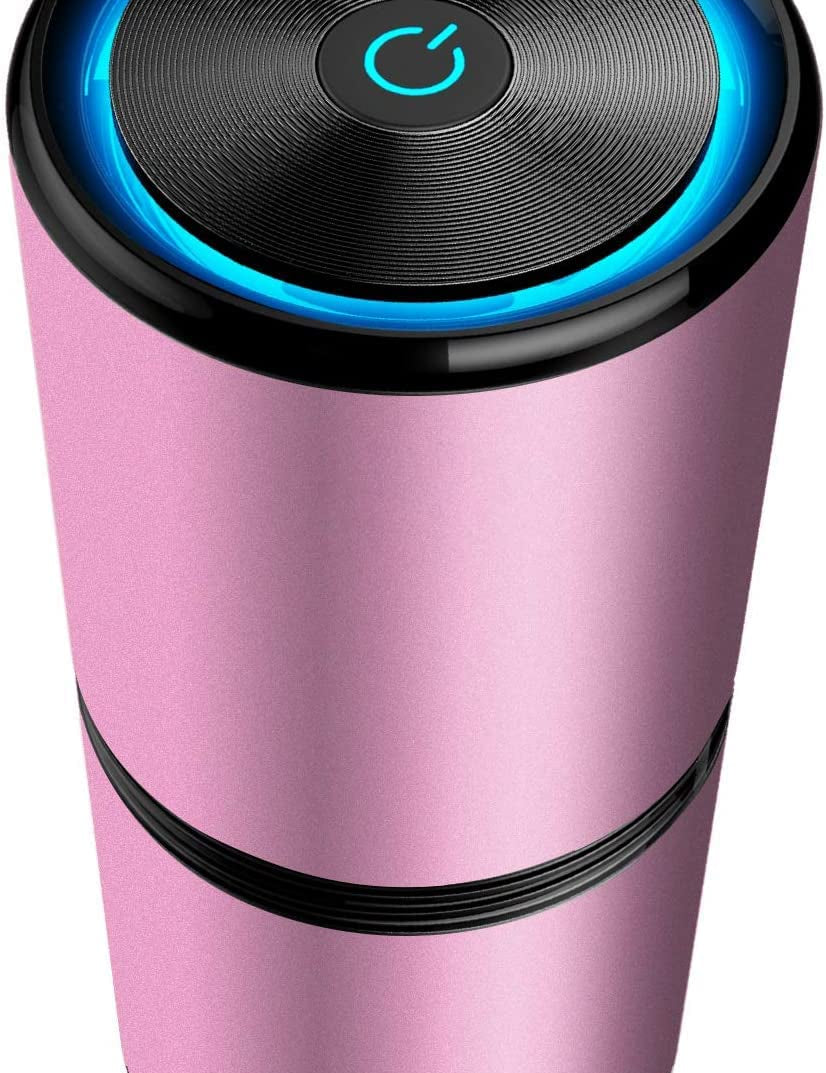 Umidificatore portatile rosa con design cilindrico, pulsante di accensione illuminato, ideale per casa e ufficio. Accessorio elegante e funzionale.