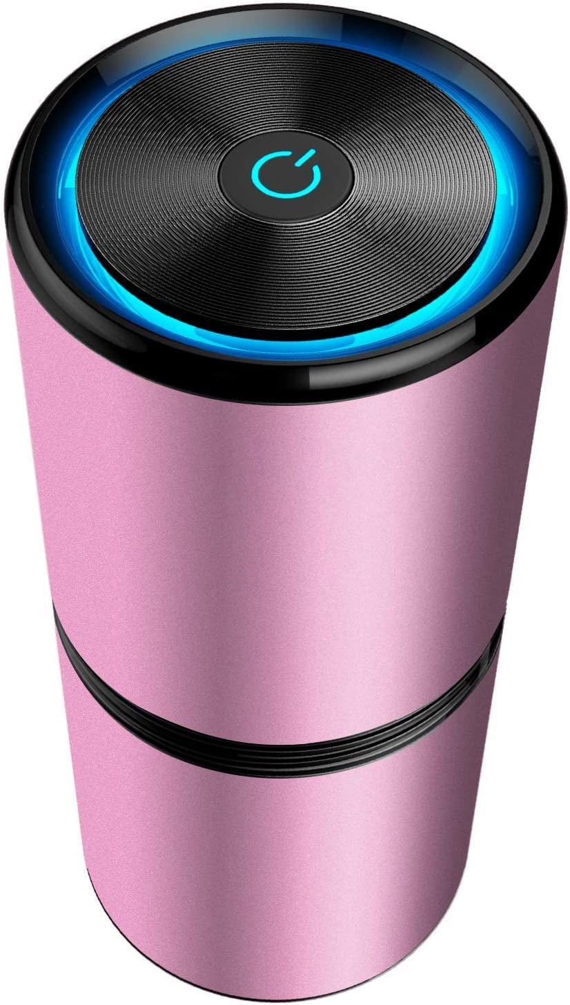 Umidificatore portatile rosa con design cilindrico, pulsante di accensione illuminato, ideale per casa e ufficio. Accessorio elegante e funzionale.