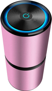 Umidificatore portatile rosa con design cilindrico, pulsante di accensione illuminato, ideale per casa e ufficio. Accessorio elegante e funzionale.