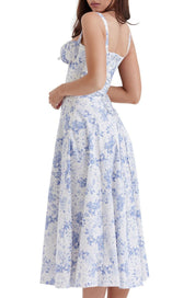 Abito estivo donna floreale bianco e blu, lunghezza midi, spalline sottili, stile casual elegante, perfetto per la moda primavera estate.
