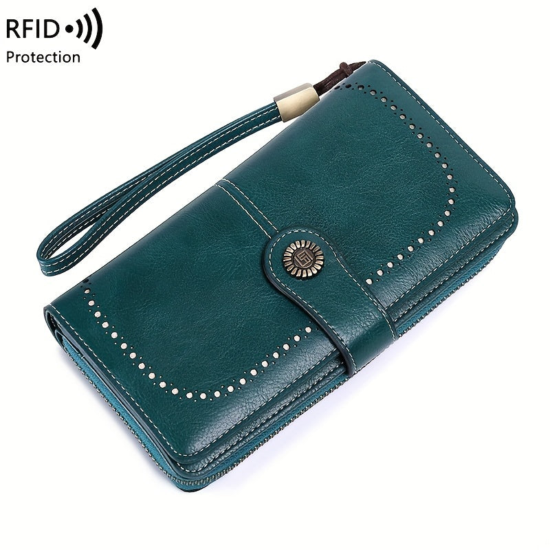 Portafoglio donna in pelle verde con protezione RFID, chiusura a bottone, cinturino da polso, design elegante e spazioso, ideale per sicurezza e stile.