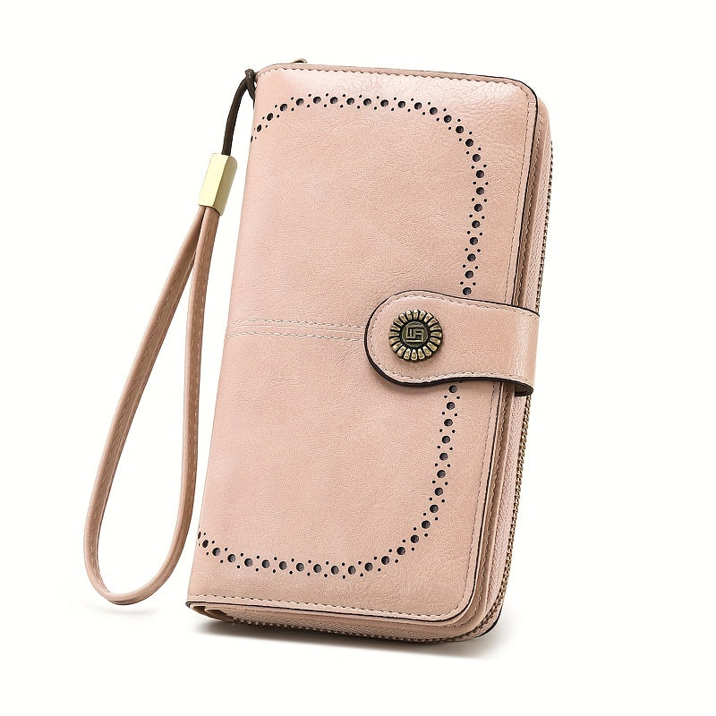 Portafoglio donna in pelle rosa con cinturino da polso, chiusura a bottone, dettagli traforati, elegante e spazioso, ideale per moda e accessori.