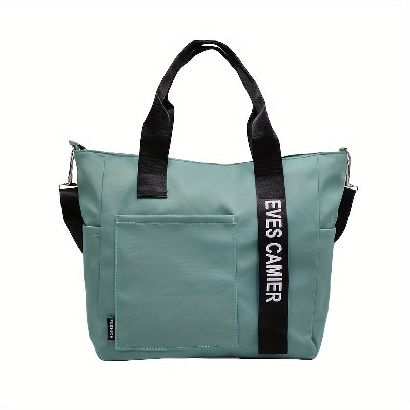Borsa a tracolla verde acqua con manici neri, tasca frontale e scritta "EVES CAMIER". Design moderno, ideale per moda donna e shopping.