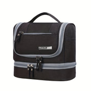 Borsa da viaggio nera con manico, doppia cerniera e tasca frontale. Design compatto, ideale per organizzare accessori da viaggio.