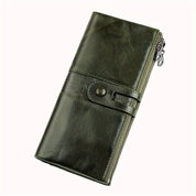 Portafoglio lungo in pelle verde scuro con chiusura a bottone e cerniera laterale, design elegante e funzionale, accessorio moda uomo e donna.