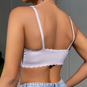 Top donna senza maniche in tessuto morbido, colore lavanda, con spalline regolabili e orlo ondulato. Ideale per look estivi casual.