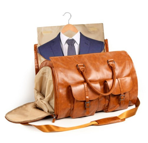 Borsa da viaggio in pelle marrone con scomparto porta abiti, appendiabiti e tasche frontali. Ideale per viaggi d'affari e weekend.