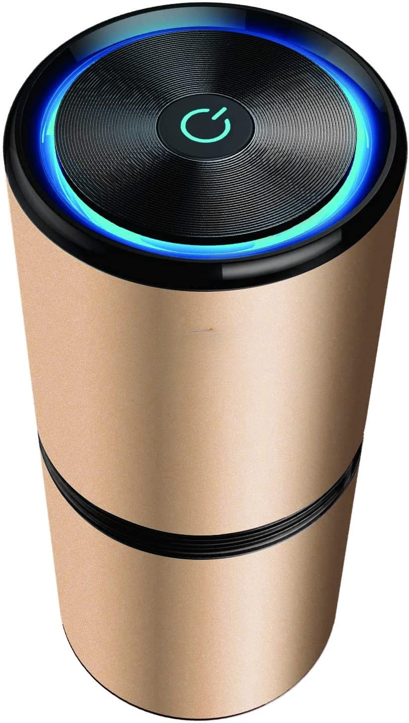 Purificatore d'aria portatile dorato con luce LED blu, design cilindrico moderno, pulsante di accensione centrale. Ideale per casa e ufficio.