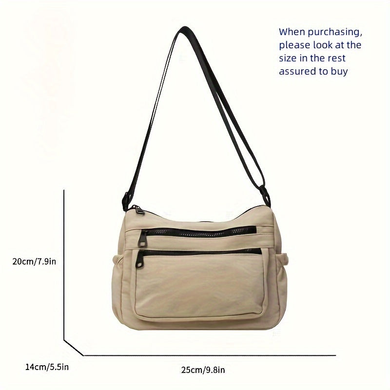 Borsa a tracolla beige con tasche multiple e cerniere nere, dimensioni 25x20x14 cm, tracolla regolabile. Accessorio moda donna elegante e pratico.
