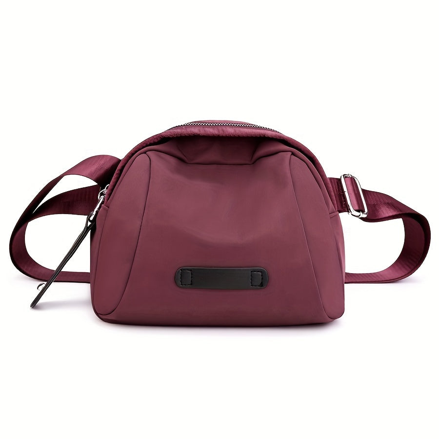 Borsa a tracolla in nylon bordeaux, design compatto, chiusura con zip, cinturino regolabile, ideale per moda donna e accessori eleganti.