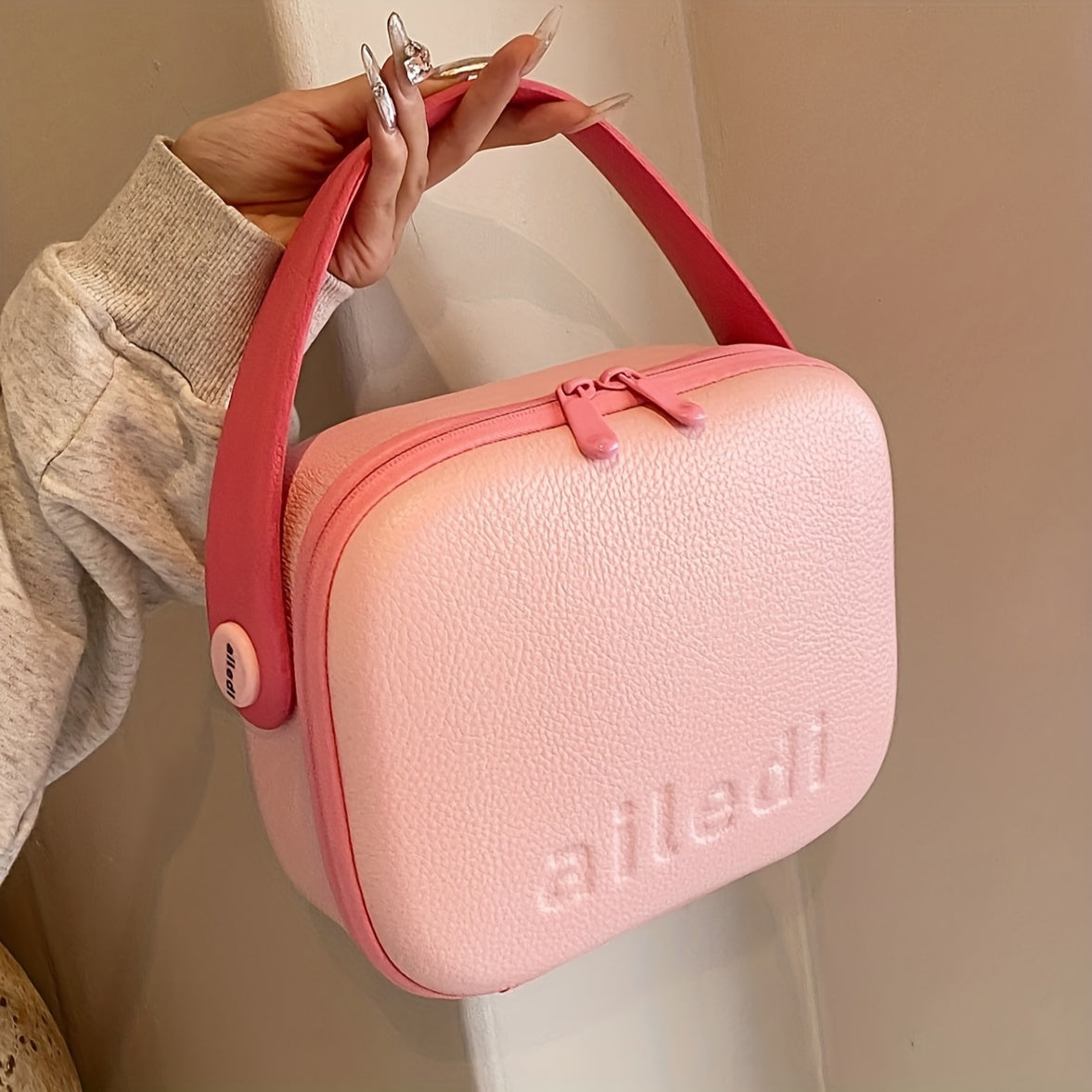Borsa a tracolla rosa e beige, design moderno, chiusura con zip, manico ergonomico, ideale per moda femminile e accessori eleganti.