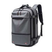 Zaino da viaggio grigio impermeabile, design moderno, con tasche multiple e spallacci imbottiti, ideale per laptop e accessori, perfetto per lavoro e avventure.