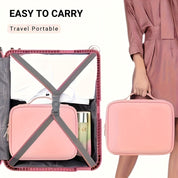 Valigia rosa compatta da viaggio, facile da trasportare, con cinghie di sicurezza. Ideale per organizzare vestiti e accessori.