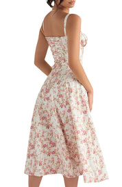 Abito estivo donna floreale, lunghezza midi, spalline sottili, stampa rosa su sfondo bianco. Elegante e femminile, perfetto per occasioni estive.