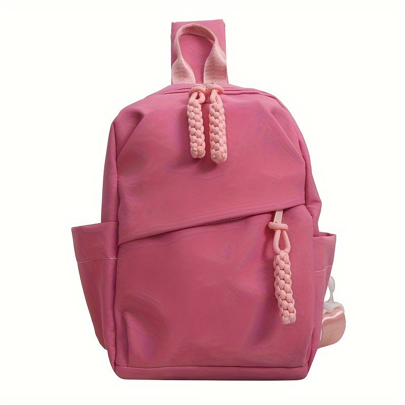 Zaino rosa per bambini con tasche laterali e chiusura a zip, design moderno e resistente, ideale per scuola e tempo libero. Accessorio moda pratico.
