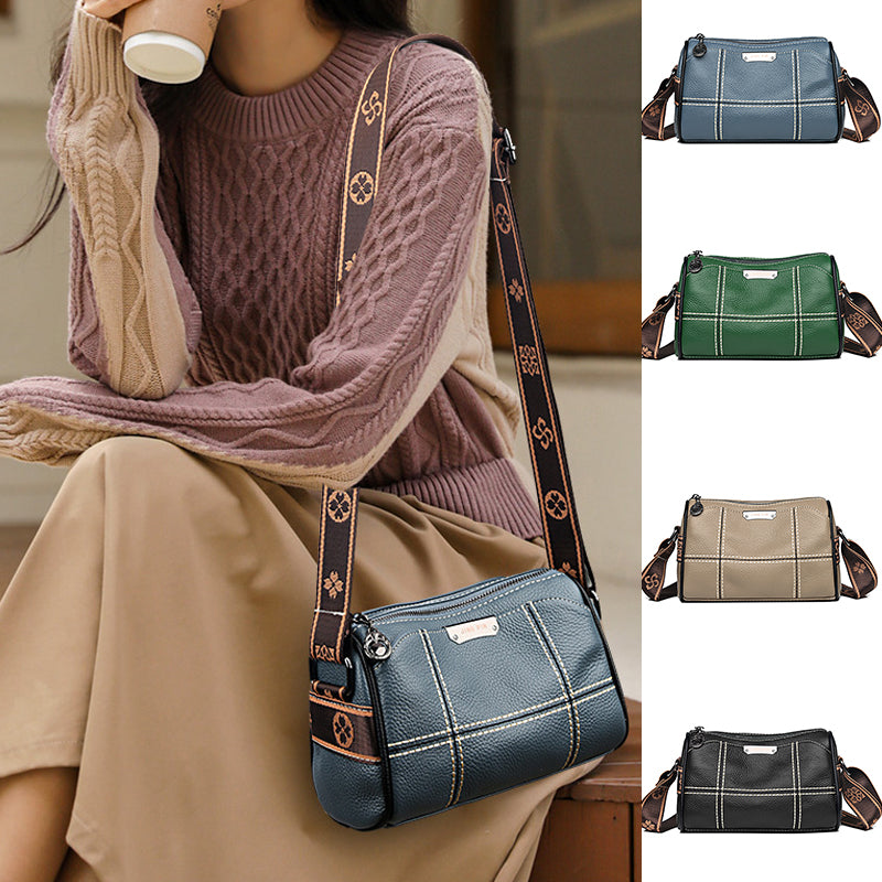 Borsa a tracolla in pelle blu con cuciture bianche, disponibile in vari colori. Design elegante, ideale per moda donna autunno inverno.