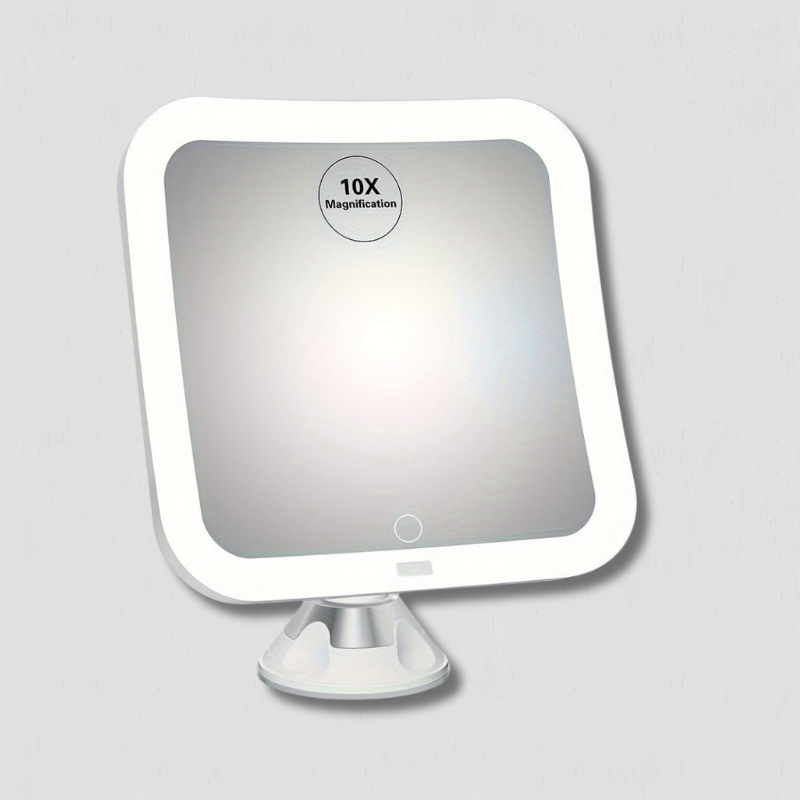 Specchio ingranditore 10x con luce LED, design quadrato, montaggio a ventosa, ideale per trucco e cura del viso, accessorio bagno moderno.