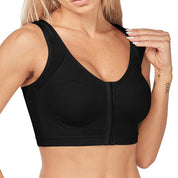 Donna in reggiseno sportivo nero con chiusura frontale, design senza cuciture, supporto elevato. Ideale per fitness, yoga, allenamento.