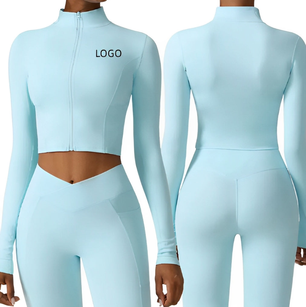 Set coordinato sportivo donna azzurro, top a maniche lunghe con zip e leggings a vita alta. Abbigliamento fitness elegante e confortevole.