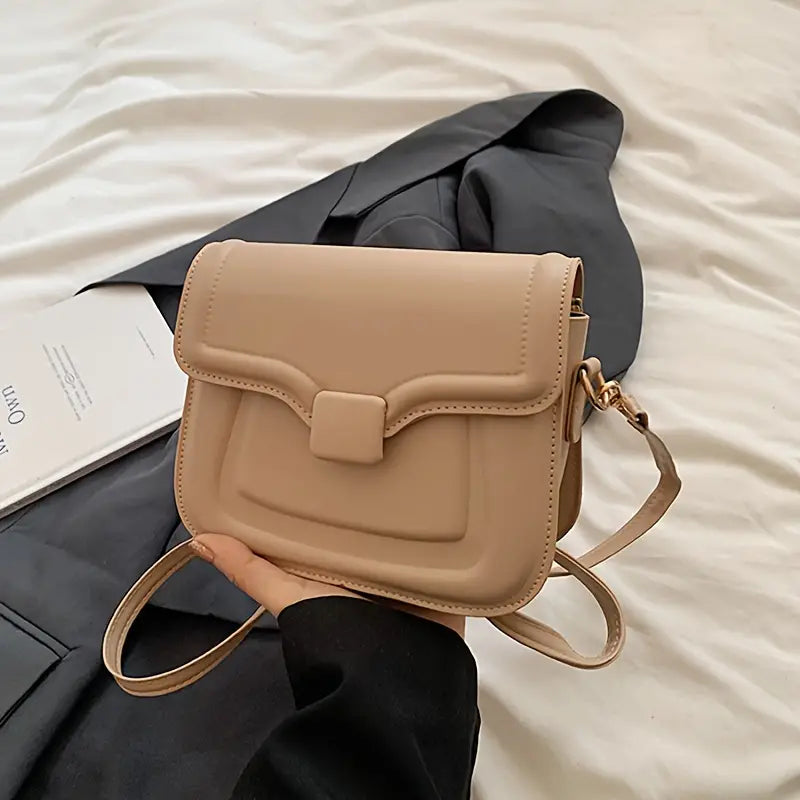 Borsa a tracolla beige su sfondo nero, design elegante e moderno, perfetta per moda femminile. Accessorio versatile per ogni occasione.