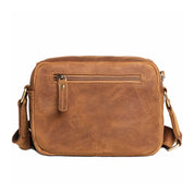 Borsa a tracolla in pelle marrone con tasca frontale con zip, design elegante e resistente, ideale per uomo e donna. Accessorio moda versatile.