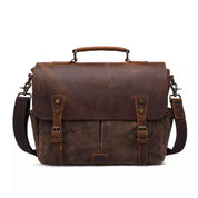 Borsa messenger in pelle marrone vintage con fibbie, tracolla regolabile e manico superiore. Elegante e resistente, ideale per lavoro e viaggio.