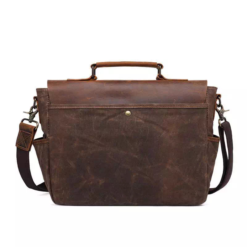 Borsa a tracolla in pelle marrone vintage, design elegante e resistente, ideale per lavoro e viaggio. Tasche multiple, chiusura sicura.