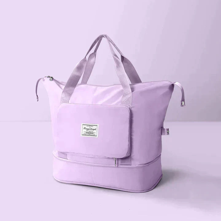 Borsa da viaggio grande in tessuto lavanda con manici robusti, tasca frontale con zip e scomparto inferiore. Elegante e funzionale per viaggi.