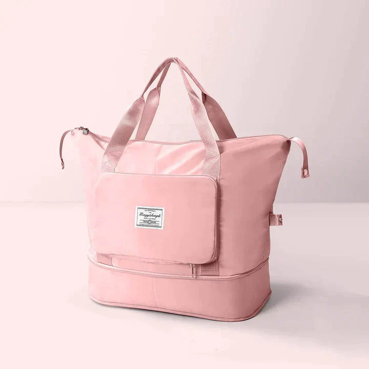 Borsa da viaggio rosa in tessuto impermeabile con manici rinforzati, tasca frontale con zip e scomparto inferiore. Elegante e pratica per viaggi.