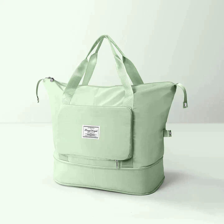 Borsa da viaggio verde menta con manici, tasca frontale con zip e scomparto inferiore. Design elegante e spazioso per viaggi e weekend.