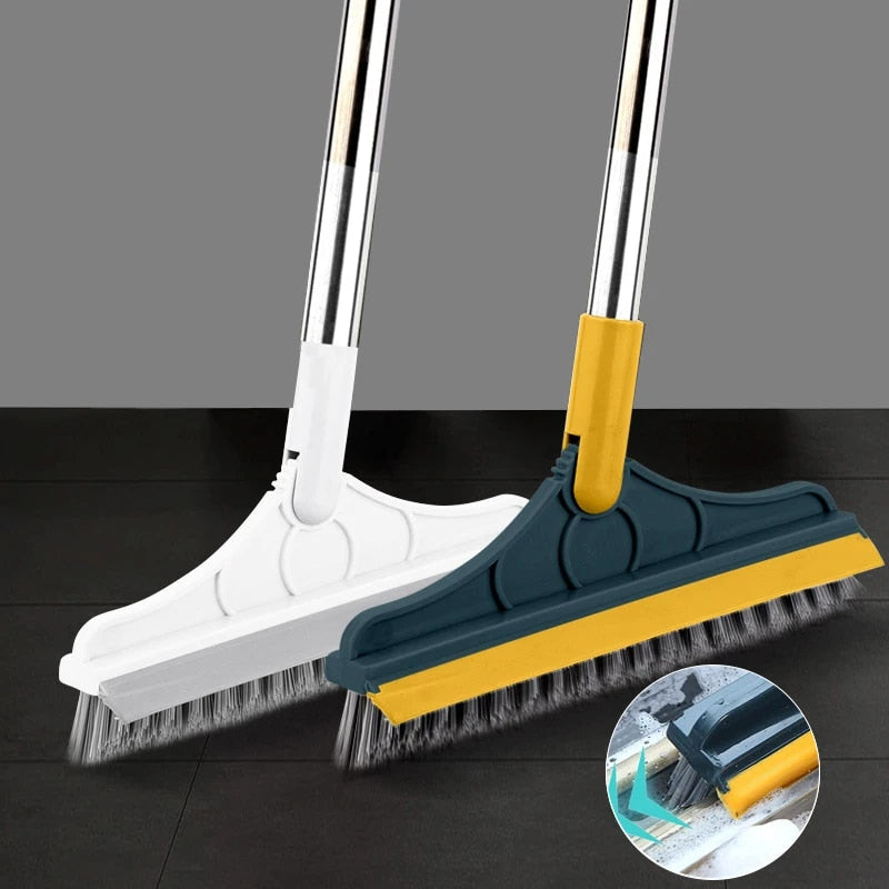 Due spazzole per pavimenti con setole rigide, manico in acciaio inox, una bianca e una gialla, ideali per pulizia profonda di piastrelle e superfici dure.