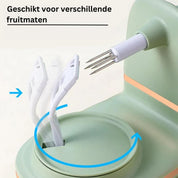 Dispositivo sbucciatore automatico verde per frutta, adatto a diverse dimensioni. Utensile da cucina innovativo con lame rotanti.