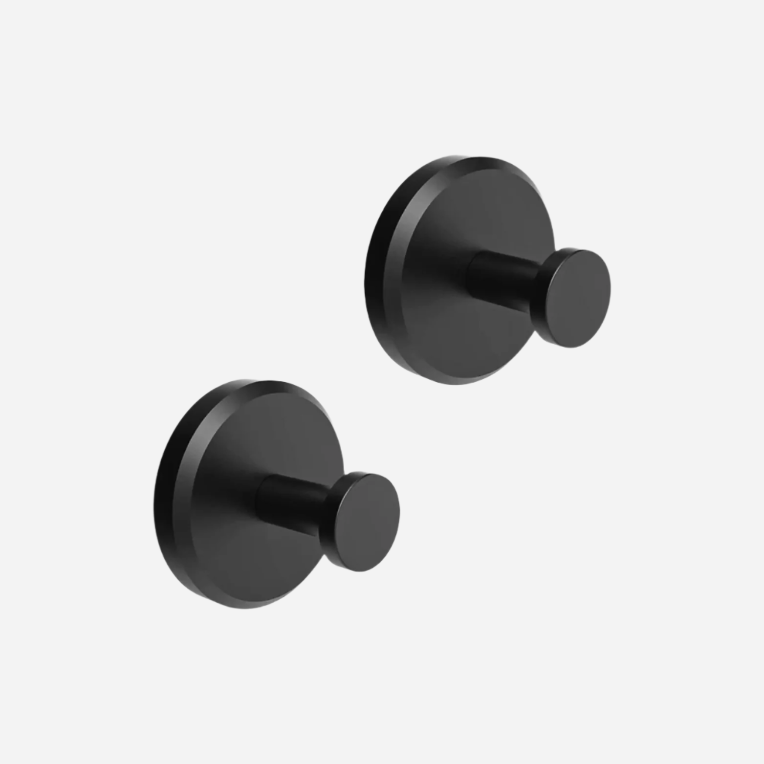 Due ganci appendiabiti neri in metallo, design moderno e minimalista, montati a parete, ideali per bagno o ingresso. Accessori casa eleganti.