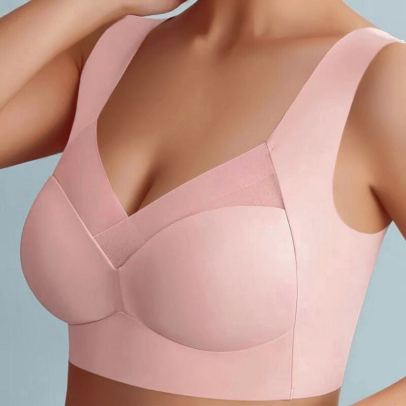 Reggiseno sportivo rosa senza cuciture, design a V, supporto confortevole, spalline larghe, ideale per attività sportive e uso quotidiano.