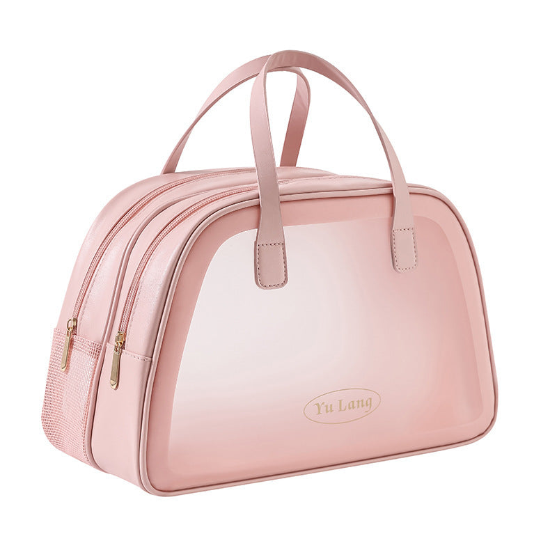 Borsa da viaggio rosa in pelle sintetica con doppia cerniera e manici, design elegante e spazioso, ideale per viaggi e uso quotidiano.