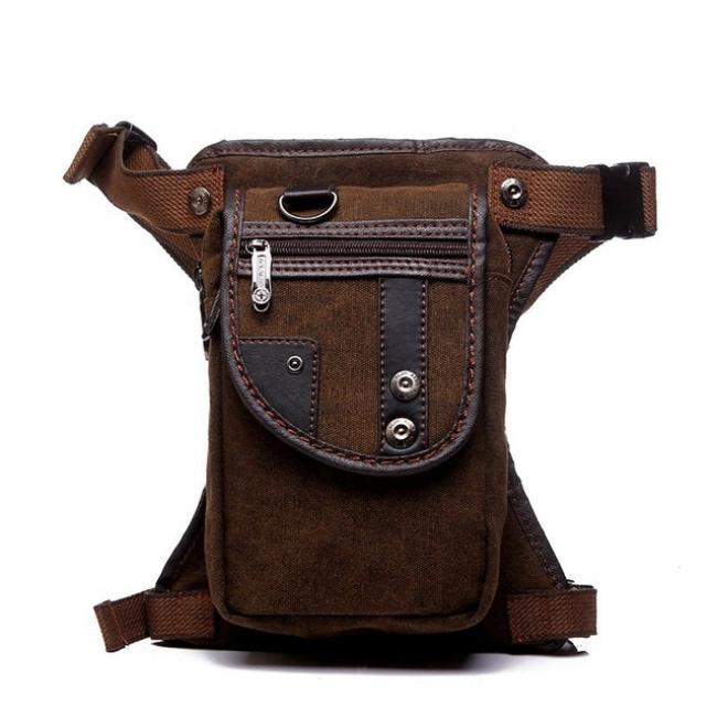 Marsupio in tela marrone con cerniere e bottoni, design vintage, ideale per escursioni e viaggi. Tasche multiple, resistente e pratico.