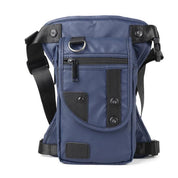 Marsupio a tracolla blu in nylon con tasche multiple, cerniere nere e dettagli in pelle. Design unisex, ideale per viaggi e attività all'aperto.