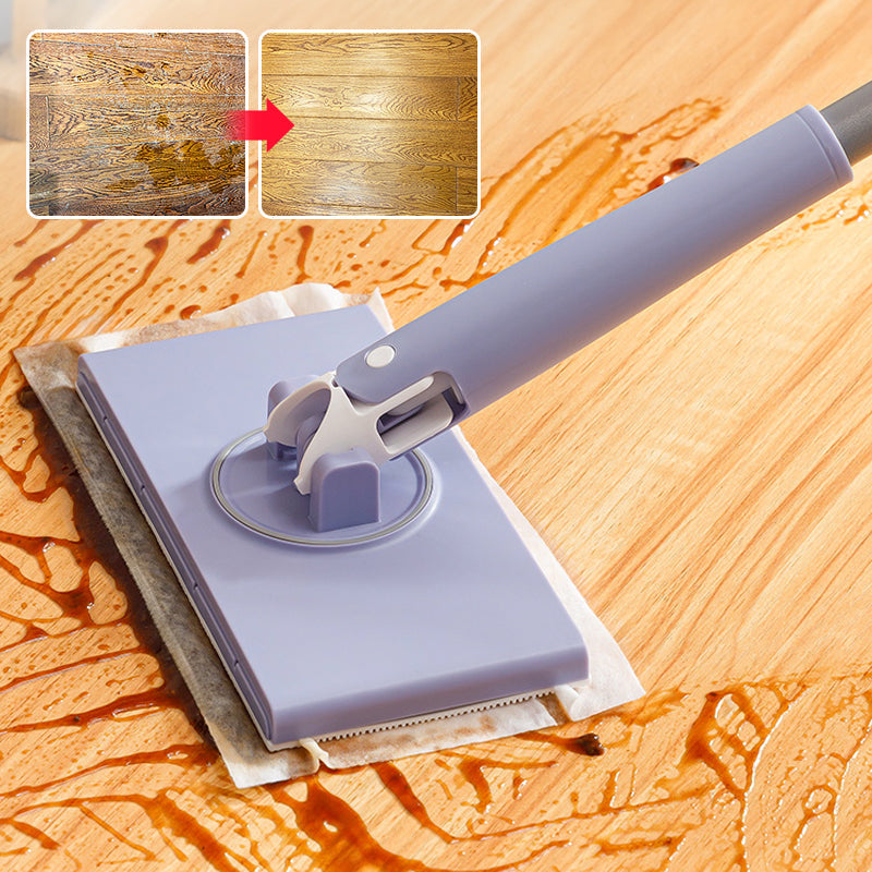 Mocio piatto in microfibra su pavimento in legno, assorbe liquidi. Pulizia efficace, strumento domestico essenziale per superfici dure.