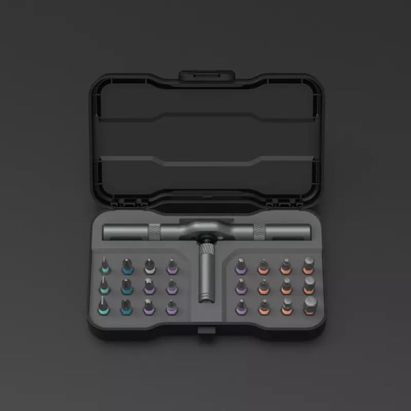 Set di cacciaviti di precisione in custodia nera aperta, con manico ergonomico e punte intercambiabili colorate, ideale per riparazioni elettroniche.