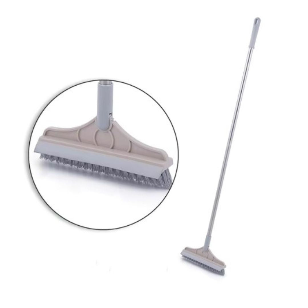 Scopa con setole rigide e manico lungo in metallo, ideale per pulizia pavimenti interni ed esterni. Strumento versatile per casa e giardino.