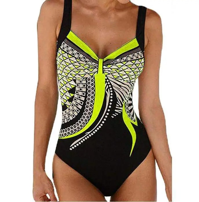 Costume intero donna nero con stampa geometrica verde e bianca, spalline larghe, design moderno. Ideale per nuoto e spiaggia.