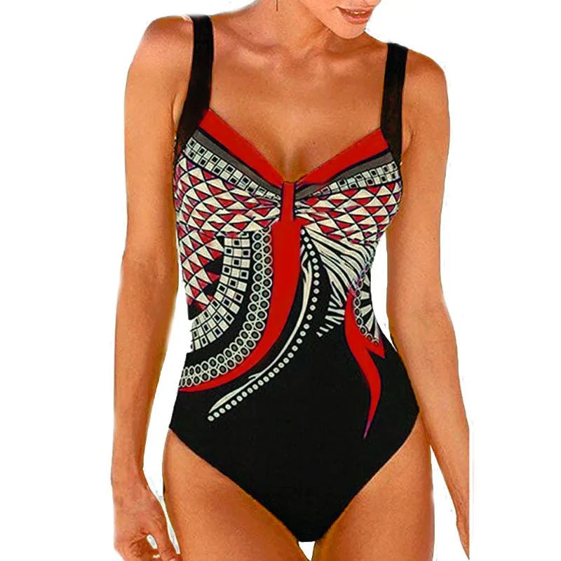 Costume intero donna nero con stampa geometrica rossa e bianca, spalline regolabili. Moda mare, abbigliamento estivo, beachwear elegante.