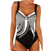 Costume intero donna nero con motivo geometrico bianco e dorato, spalline larghe, design elegante. Perfetto per spiaggia e piscina.