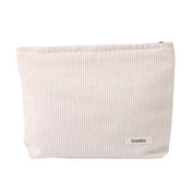 Borsa cosmetica beige a coste, Sozakka, elegante e pratica, ideale per organizzare trucchi e accessori. Design minimalista e moderno.